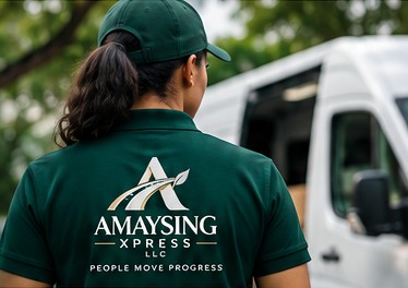 Amaysing Xpress team member in a branded green polo and cap standing beside a delivery van